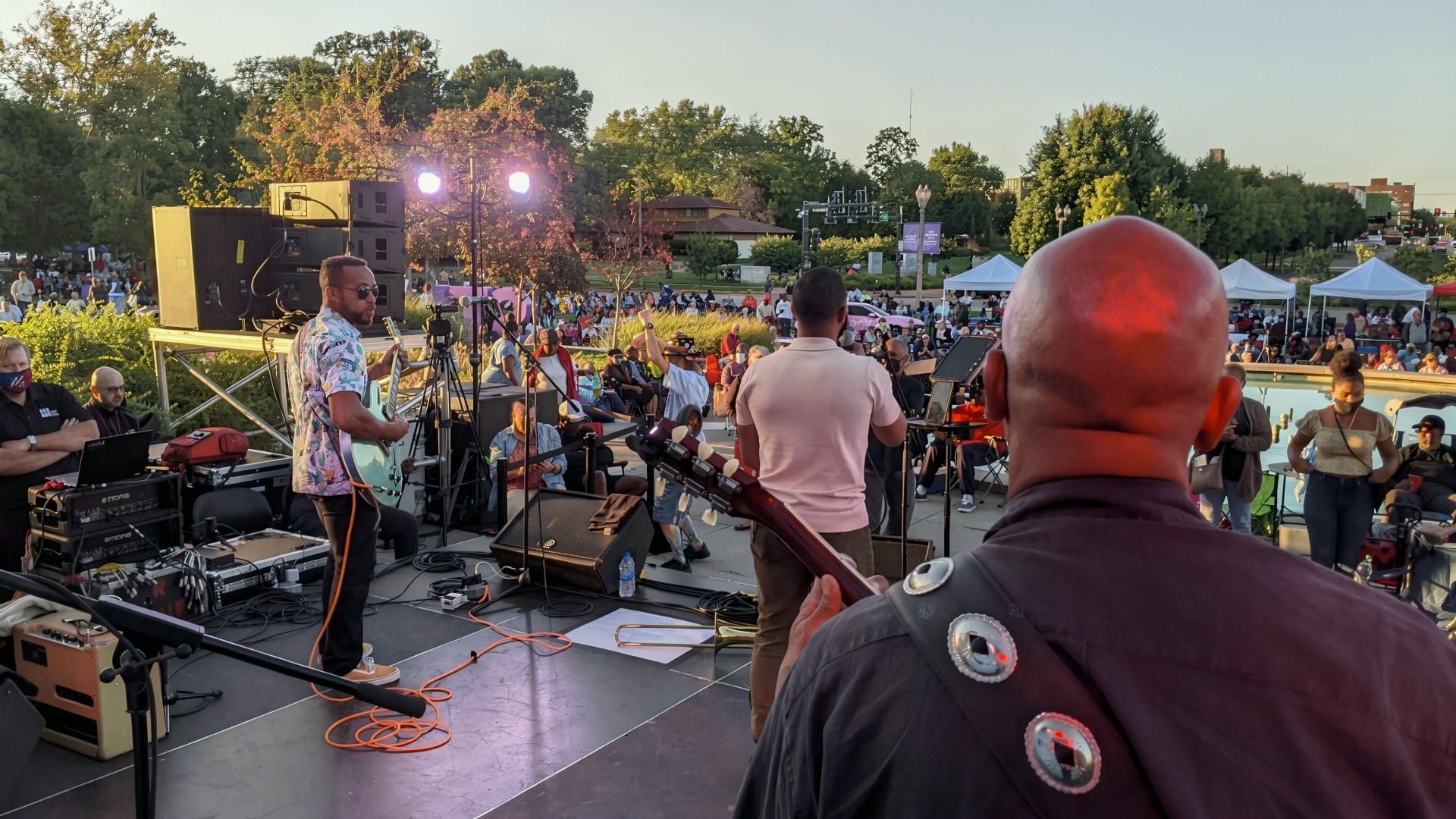 Charlie Berry on an outdoor stage at sunset